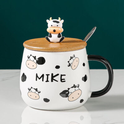 ceramic coffee mug with lid and spoon