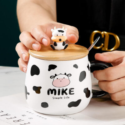 ceramic coffee mug with lid and spoon