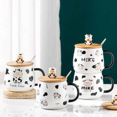 ceramic coffee mug with lid and spoon