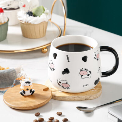 ceramic coffee mug with lid and spoon