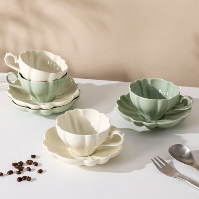 ceramic tea mug with saucer and spoon