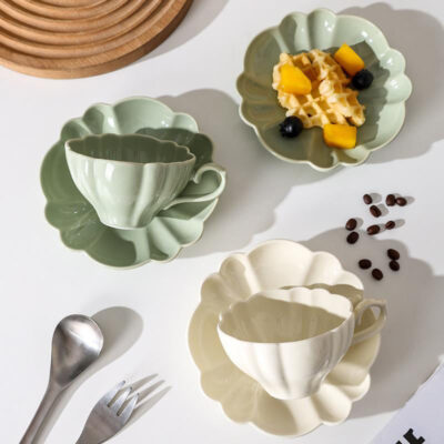 ceramic tea mug with saucer and spoon