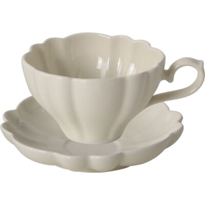ceramic tea mug with saucer and spoon