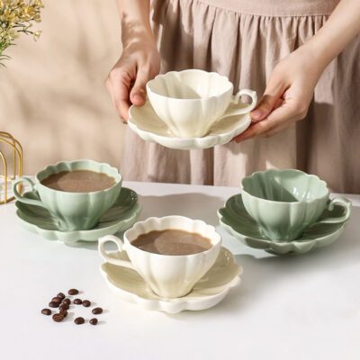 ceramic tea mug with saucer and spoon