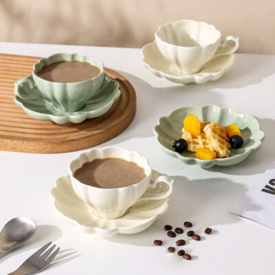 ceramic tea mug with saucer and spoon